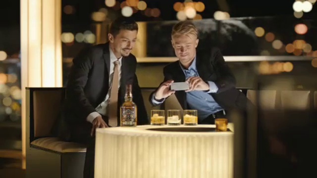 Video Reference: Coat, Tie, Tableware, Table, Bottle, Drinkware, Suit, Alcoholic beverage, Drink, Formal wear