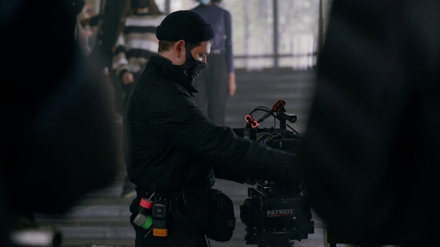 Video Reference: Wheel, Flash photography, Cap, Street fashion, Hat, Tire, Darkness, Event, Sun hat, Personal protective equipment