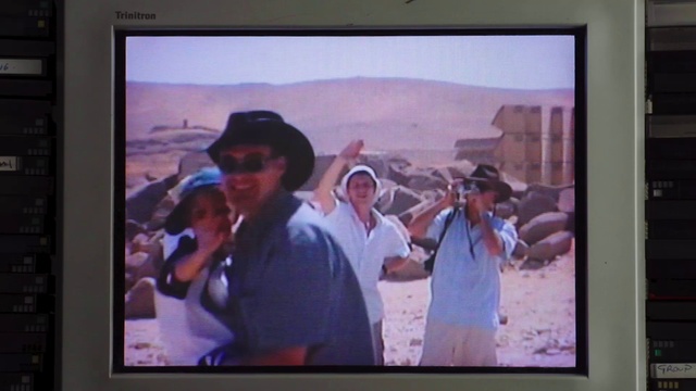 Video Reference: Hat, White, Gesture, Television set, Television program, Flat panel display, Display device, Gadget, Electronic device, Multimedia