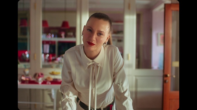 Video Reference: Face, Dress shirt, Sleeve, Collar, Happy, Flash photography, Shelf, Fashion design, Event, T-shirt