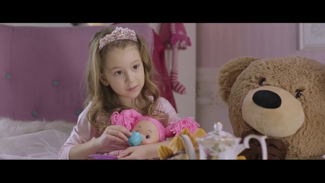 Video Reference: Skin, Head, Facial expression, Toy, Purple, Pink, Happy, Headgear, Teddy bear, Toddler