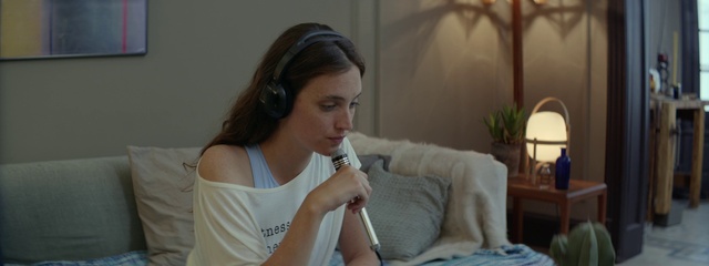 Video Reference: Shoulder, Mouth, Plant, Neck, Houseplant, Gesture, Microphone, Audio equipment, Comfort, Eyelash