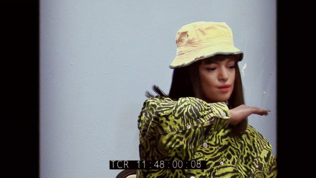 Video Reference: Hairstyle, Flash photography, Sleeve, Cap, Headgear, Hat, Cool, Fashion design, Eyelash, Happy