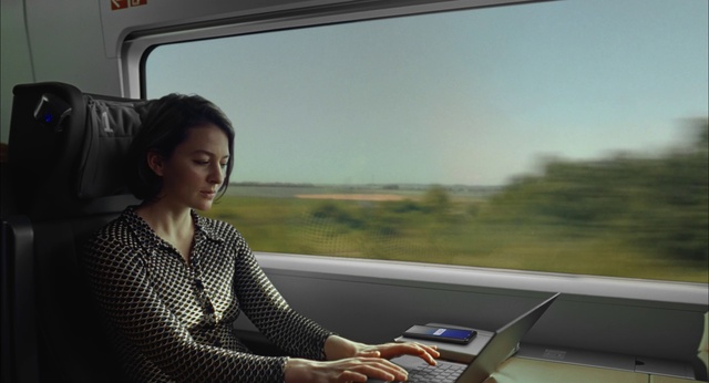 Video Reference: Typing, Train, Laptop, Personal computer, Mode of transport, Computer, Sky, Travel, Netbook, Office supplies