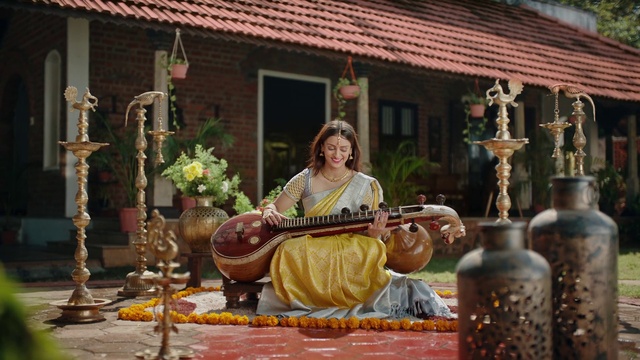 Video Reference: Temple, Musical instrument, Window, Leisure, Plant, String instrument, Plucked string instruments, Event, String instrument, Folk instrument