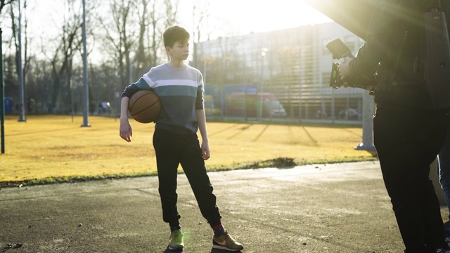 Video Reference: Sky, Plant, Tree, Flash photography, Standing, Sunlight, Happy, Grass, Sports equipment, Ball