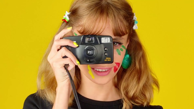 Video Reference: Lip, Hand, Vision care, Eyebrow, Eyelash, Flash photography, Neck, Digital camera, Cameras & optics, Orange