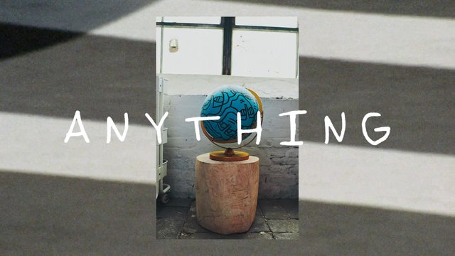 Video Reference: globe, decorative object, indoor, window, brick wall, pedestal, text overlay, interior, still life, art object, centered, minimalism