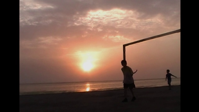 Video Reference: Cloud, Sky, Water, People in nature, Flash photography, Beach, Gesture, Sunlight, Afterglow, Body of water