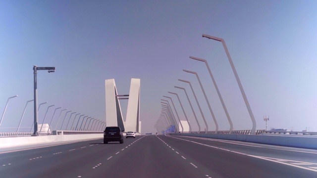 Video Reference: Sky, Street light, Car, Infrastructure, Road surface, Asphalt, Lighting, Mode of transport, Architecture, Vehicle