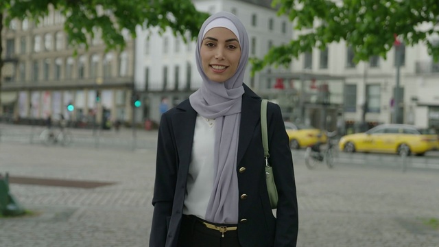 Video Reference: Smile, Wheel, Sleeve, Tire, Street fashion, Eyewear, Yellow, Collar, Headgear, Road surface