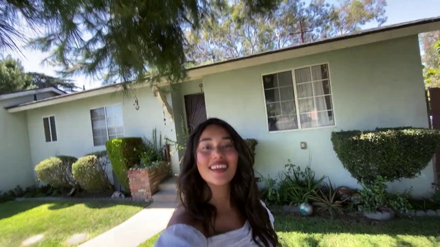Video Reference: Hair, Plant, Smile, Property, Window, Botany, Land lot, Building, Grass, Real estate