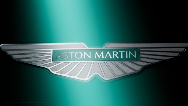 Video Reference: Aston Martin, logo, car brand, emblem, winged badge, teal background, automotive, luxury, branding, centered, gradient, metallic, close-up