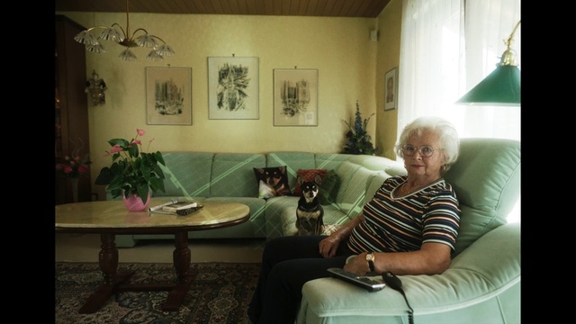 Video Reference: Table, Plant, Furniture, Picture frame, Comfort, Interior design, Houseplant, Living room, Event, Couch