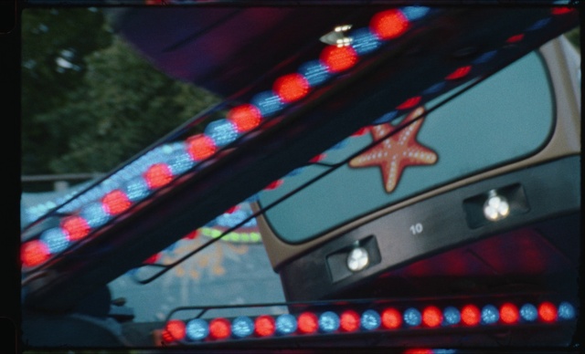 Video Reference: Automotive lighting, Photographic film, Bumper, Automotive exterior, Vehicle door, Communication Device, Font, Tints and shades, Tree, Magenta