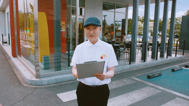 Video Reference: Sleeve, Leisure, Cap, Swimming pool, Room, Baseball cap, Recreation, White-collar worker, Job, Uniform