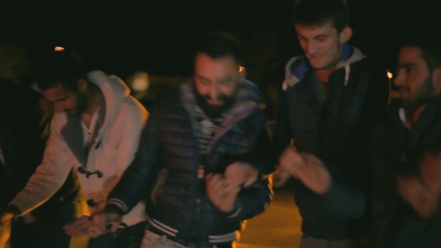 Video Reference: Gesture, Entertainment, Fun, Midnight, Jacket, Event, Darkness, Hat, Crowd, Uniform