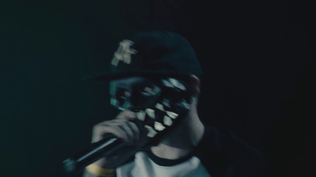 Video Reference: Microphone, Flash photography, Hat, Musician, Cap, Music, Eyewear, Performing arts, Audio equipment, Entertainment