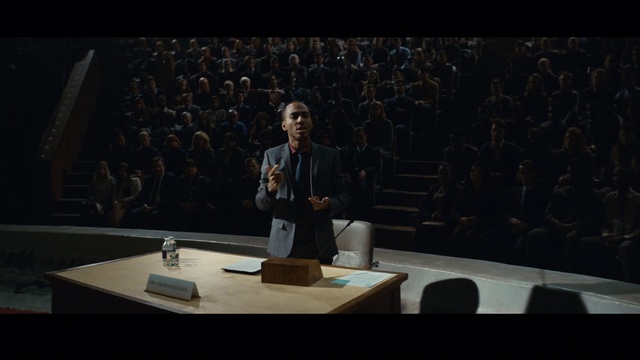 Video Reference: Microphone, Suit, Public address system, Spokesperson, Public speaking, Table, Event, Speech, Tie, Speaker