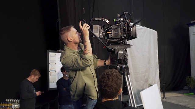 Video Reference: Shirt, Videographer, Tripod, Television crew, Film crew, Camera, Cinematographer, Musician, Video camera, Documentary