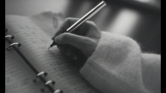 Video Reference: Hand, Writing implement, Gesture, Office supplies, Handwriting, Style, Black-and-white, Writing instrument accessory, Book, Font