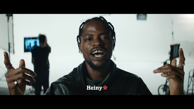 Video Reference: Flash photography, Gesture, Cool, Thumb, Technology, Font, Electronic device, Audio equipment, T-shirt, Music artist