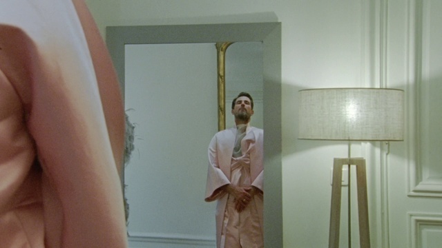 Video Reference: Sleeve, Interior design, Gesture, Mirror, Wood, Fashion design, Ceiling, Event, Peach, Chest