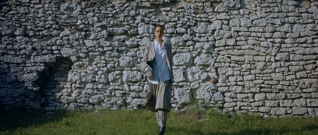 Video Reference: Plant, Sleeve, Street fashion, Bedrock, Grass, Sunglasses, Landscape, Grassland, Tree, Knee