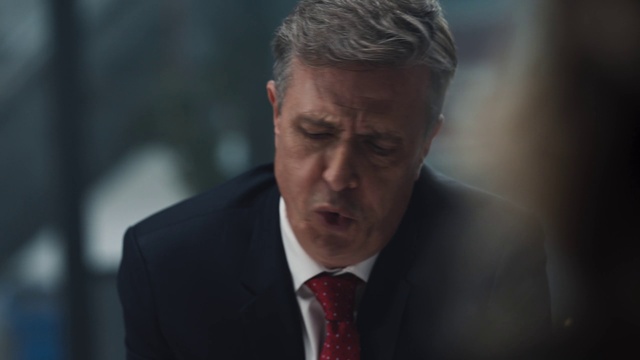 Video Reference: Forehead, Tie, Coat, Gesture, Dress shirt, Collar, Spokesperson, Suit, Ear, Blazer