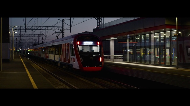 Video Reference: Train, Vehicle, Automotive lighting, Rolling stock, Sky, Transport hub, Track, Mode of transport, Electricity, Rolling