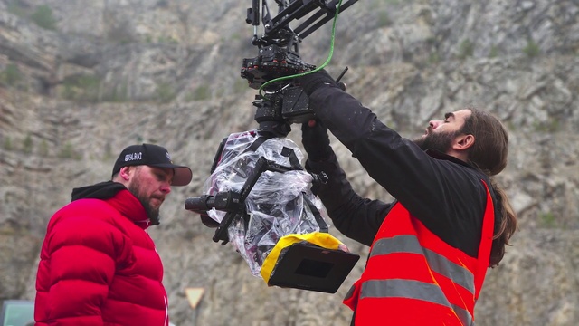 Video Reference: Gesture, Hat, Glove, Jacket, Recreation, Fun, Personal protective equipment, Baseball cap, Luggage and bags, Bag