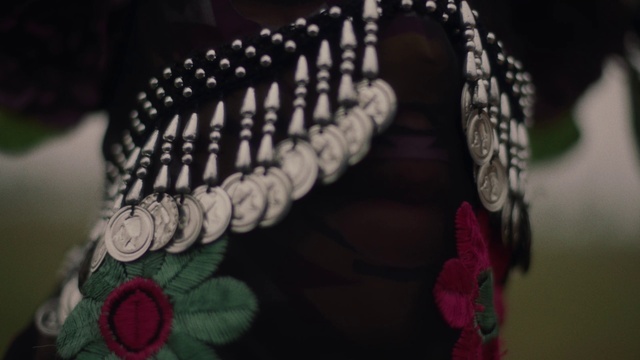 Video Reference: Font, Jewellery, Religious item, Magenta, Pattern, Art, Metal, Fashion accessory, Body jewelry, Rope