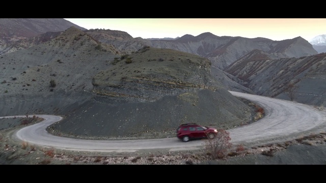 Video Reference: Car, Tire, Land vehicle, Vehicle, Wheel, Mountain, Sky, Asphalt, Slope, Road surface