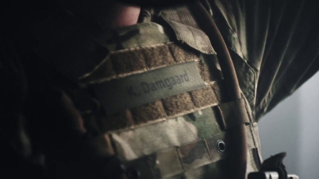 Video Reference: Automotive tire, Wood, Font, Tints and shades, Automotive lighting, Pattern, Darkness, Automotive exterior, Windshield, Personal protective equipment