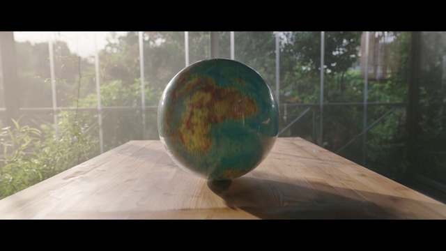 Video Reference: Wood, Table, Rectangle, Art, Ball, Tree, Astronomical object, Grass, Tints and shades, Glass