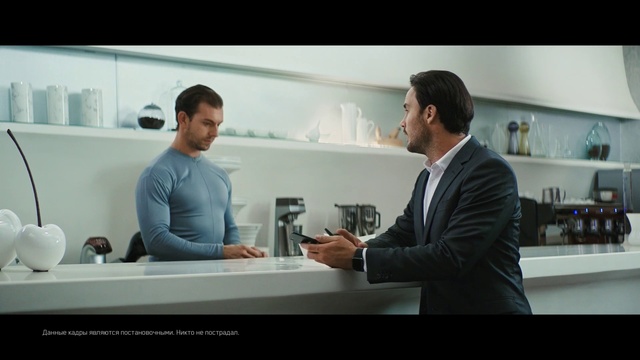 Video Reference: Shoulder, Automotive design, Eyewear, Sleeve, Shelf, Gesture, Drinkware, Tableware, White-collar worker, Suit