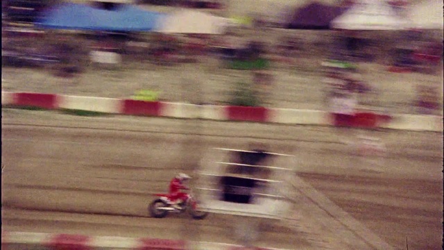 Video Reference: Wheel, Tire, Vehicle, Automotive tire, Asphalt, Wood, Pink, Grass, Road surface, Motorsport