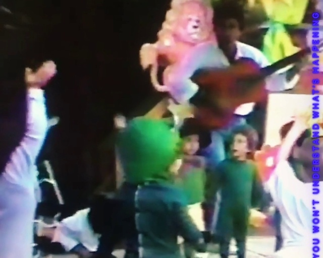 Video Reference: Purple, Gesture, Entertainment, Thigh, Leisure, Fun, Event, Performing arts, Magenta, Crowd