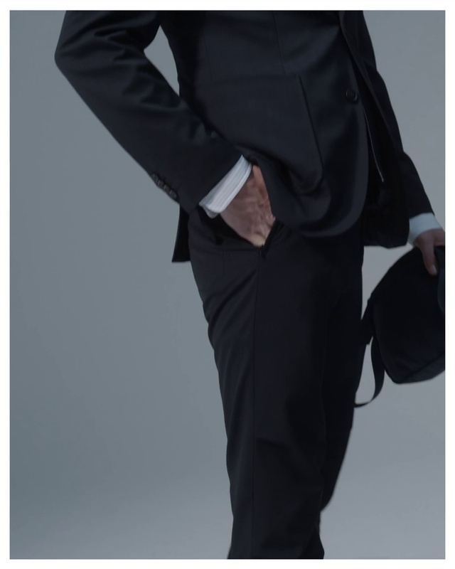 Video Reference: Suit trousers, Sleeve, Waist, Active pants, Gesture, Dress shirt, Collar, Street fashion, Blazer, Thigh