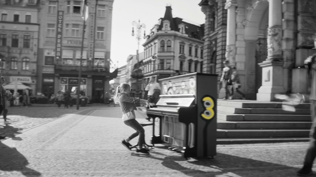 Video Reference: Building, Sky, Infrastructure, Black, Window, Road surface, Black-and-white, Architecture, Neighbourhood, Street light