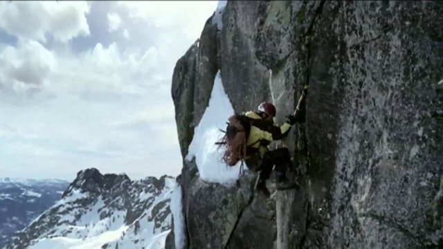 Video Reference: climbing, mountaineering, rock face, climber, helmet, harness, rope, mountain, snow, adventure, outdoor, extreme sport, vertical, alpine, summit