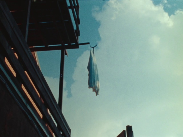Video Reference: Cloud, Sky, Building, Flag, Cumulus, Tints and shades, Facade, Pole, Metal, Electric blue