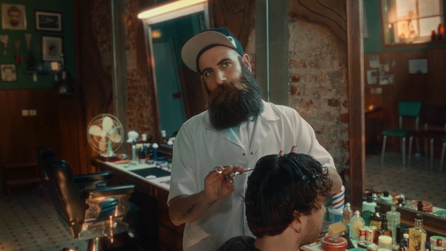 Video Reference: Human, Beard, Hat, Chair, Facial hair, Tableware, T-shirt, Event, Service, Moustache