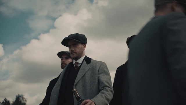 Video Reference: Cloud, Sky, Flash photography, Hat, Gesture, Suit, Blazer, Formal wear, White-collar worker, Cap