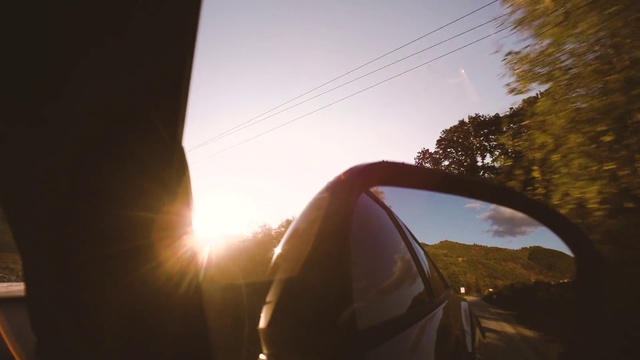 Video Reference: Mirror, Automotive side-view mirror, Sky, Automotive lighting, Vehicle, Plant, Automotive mirror, Car, Tree, Gesture