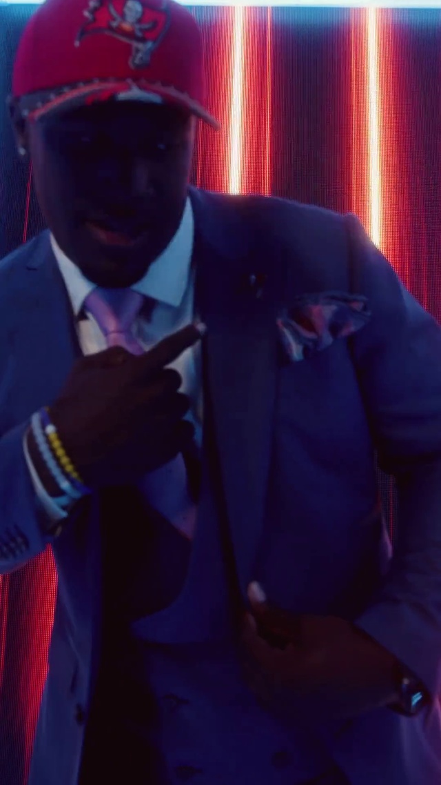 Video Reference: Coat, Hat, Tie, Cap, Gesture, Headgear, Performing arts, Red, Entertainment, Musician