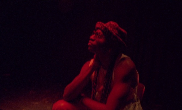 Video Reference: Performing arts, Entertainment, Beard, Elbow, Event, Artist, Performance art, Darkness, Vest, Chest