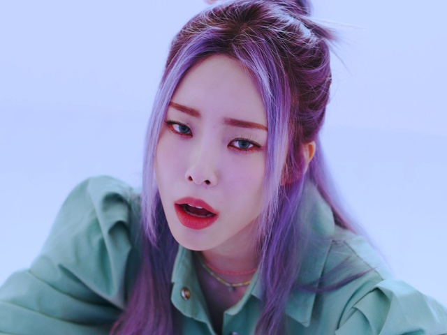 Video Reference: Hair, Nose, Cheek, Lip, Outerwear, Lipstick, Smile, Eyelash, Purple, Human body