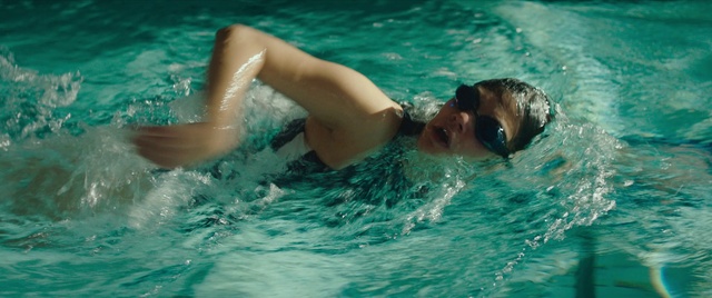 Video Reference: Water, Swimming pool, Vertebrate, Swimmer, Muscle, Human body, Cap, Medley swimming, Outdoor recreation, Headgear