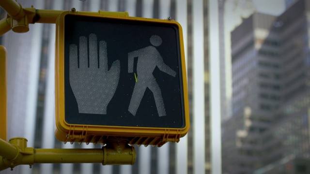 Video Reference: Gesture, Rectangle, Font, Tints and shades, Signage, Road, Pedestrian, Metal, Sign, Building